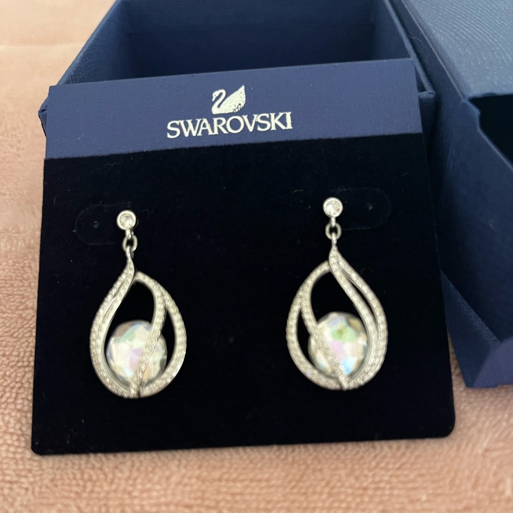 Earrings, Swarovski.  Teardrop shape with opal stones in center
